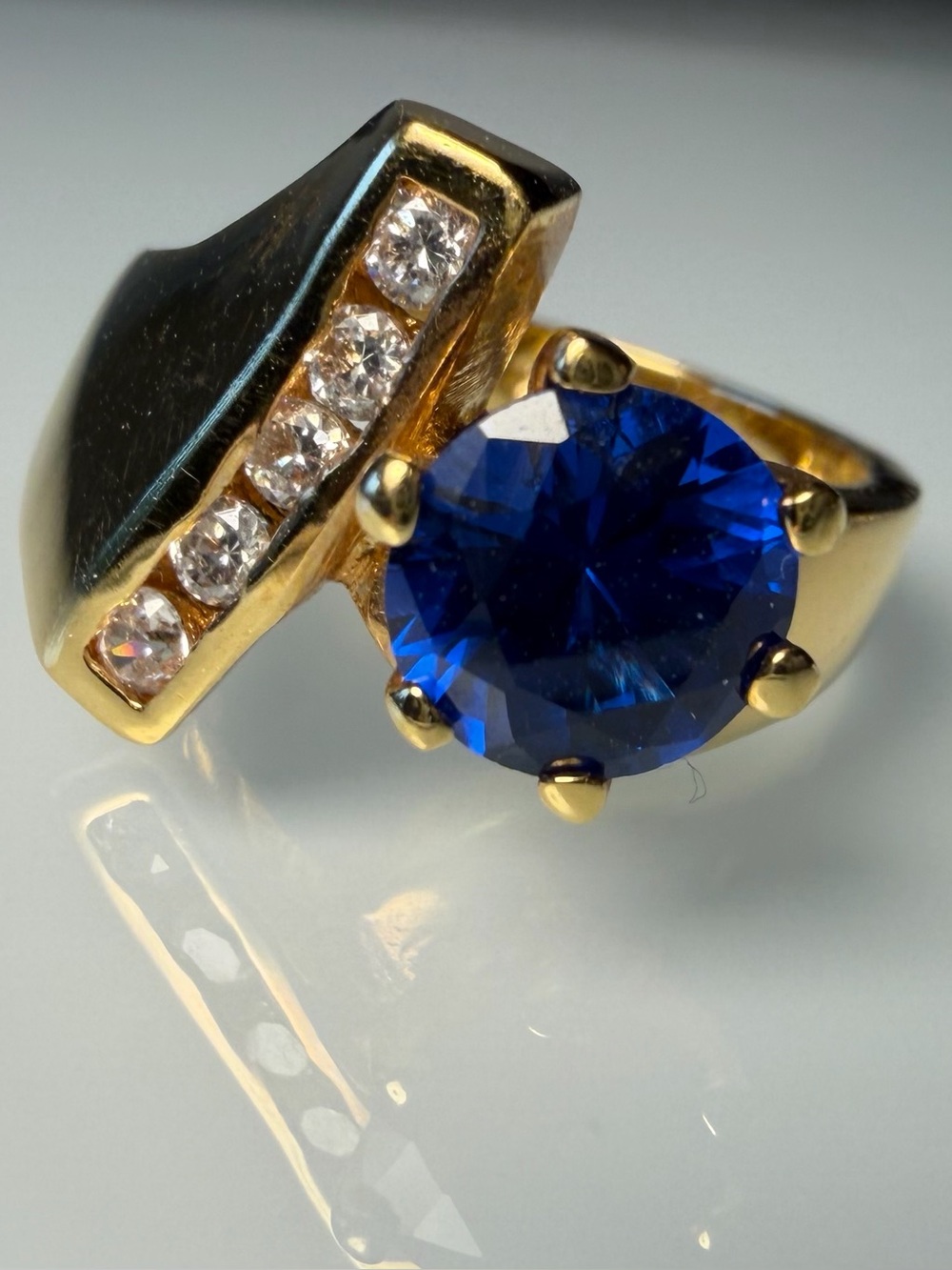 18k Gold plated over silver ring with Deep Blue Stone and Clear Accent Stones